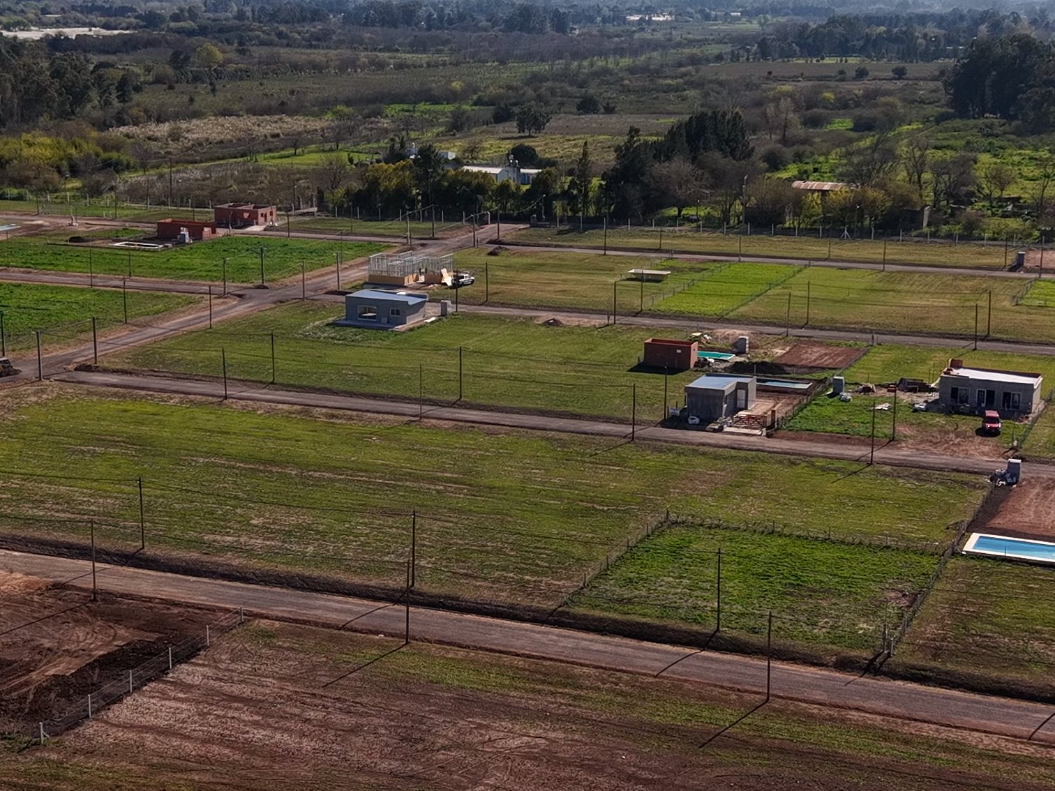 Vista aérea de San José VI en septiembre 2026: calles, lotes y primeras casas